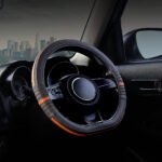 A high-quality red and black steering wheel cover with precise stitching for premium car interior aesthetics and grip